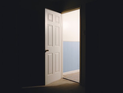 open door in dark room