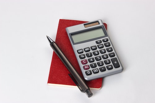 calculator on table with pen